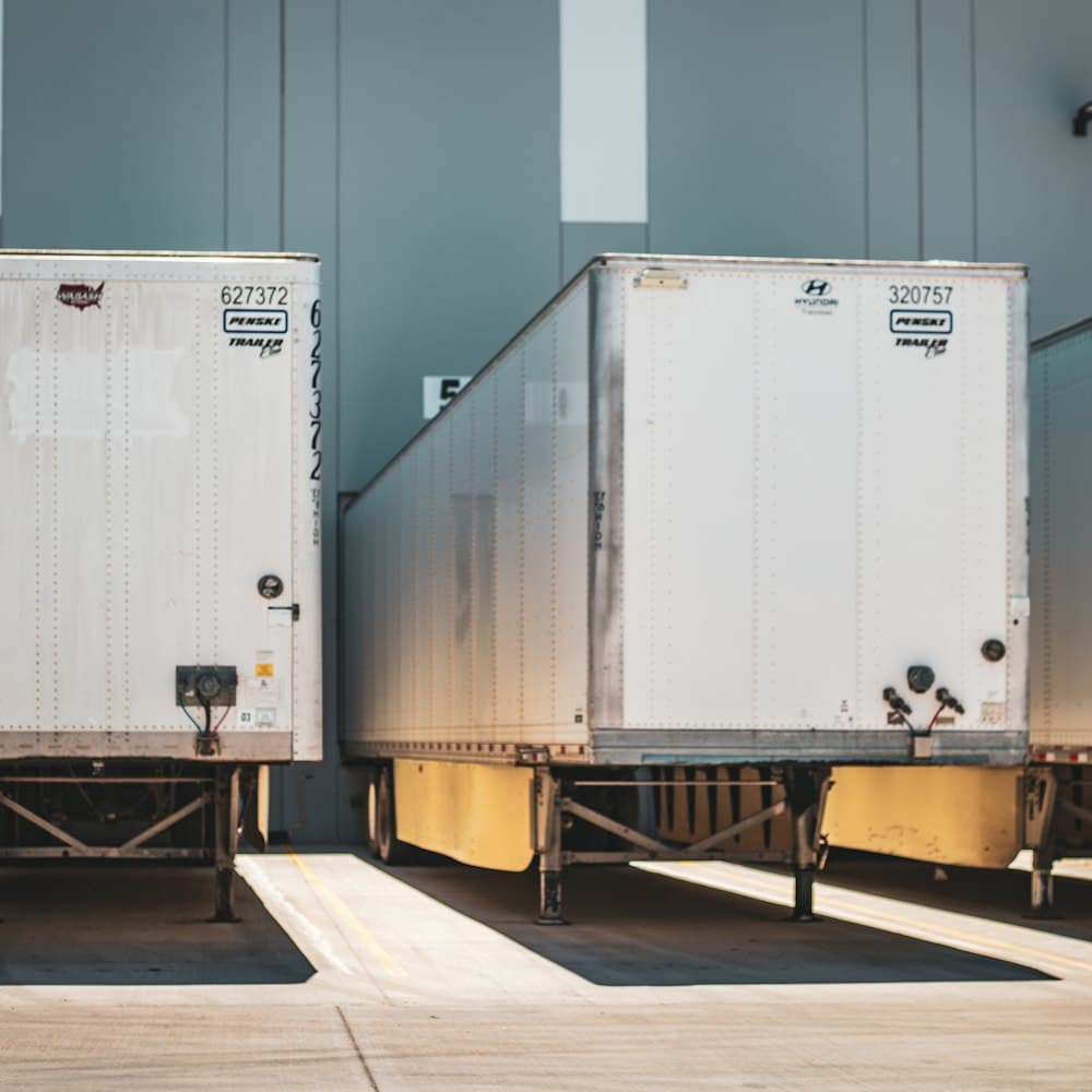 Trailers backed into loading dock bays for dispatch